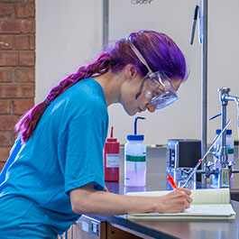 Student working at microscope